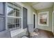 Bright entryway with tiled floors, window, and seating area at 4826 Maymont Park Cir, Bradenton, FL 34203