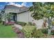 Landscaped walkway leading to the house entrance with lush greenery at 4826 Maymont Park Cir, Bradenton, FL 34203