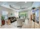 Spacious living room with reclining leather furniture and wood-look flooring at 4826 Maymont Park Cir, Bradenton, FL 34203