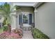 Relaxing patio area with seating and a window with shutters at 4826 Maymont Park Cir, Bradenton, FL 34203