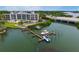 Aerial view of waterfront community with boat slips at 516 Tamiami S Trl # 102, Nokomis, FL 34275