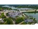 Aerial view of waterfront community with pool and boat docks at 516 Tamiami S Trl # 102, Nokomis, FL 34275