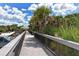 Beach boardwalk path with parking area at 516 Tamiami S Trl # 102, Nokomis, FL 34275