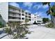 Harbor Villas condo building, three-story exterior with parking at 516 Tamiami S Trl # 102, Nokomis, FL 34275