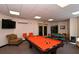 Well-lit game room with pool table and seating area at 516 Tamiami S Trl # 102, Nokomis, FL 34275