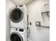 Laundry room with stackable washer and dryer at 516 Tamiami S Trl # 102, Nokomis, FL 34275