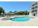 Resort-style pool with spa and comfortable seating at 516 Tamiami S Trl # 102, Nokomis, FL 34275