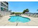 Inviting kidney-shaped pool with surrounding lounge chairs at 516 Tamiami S Trl # 102, Nokomis, FL 34275