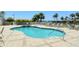 Relaxing community pool with ample lounge space at 516 Tamiami S Trl # 102, Nokomis, FL 34275