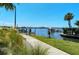 Scenic walkway to the waterfront with dock views at 516 Tamiami S Trl # 102, Nokomis, FL 34275