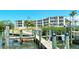 Condo building with private boat dock and walkway at 516 Tamiami S Trl # 102, Nokomis, FL 34275