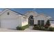 One-story house with a two-car garage and landscaped entryway at 2163 Flagstaff Dr, Punta Gorda, FL 33983