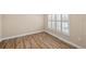 Empty bedroom with wood flooring and window with shutters at 2479 Grandview Dr, North Port, FL 34288