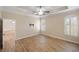 Large main bedroom with wood floors and ceiling fan at 2479 Grandview Dr, North Port, FL 34288