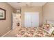 Spacious bedroom with double doors leading to the bathroom at 3129 Oriole Dr # 104, Sarasota, FL 34243