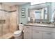 Updated bathroom with granite vanity and walk-in shower at 100 Sands Point Rd # 305, Longboat Key, FL 34228