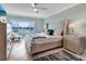 Bright bedroom with water views, king-size bed, and ample dresser space at 100 Sands Point Rd # 305, Longboat Key, FL 34228