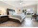 Serene bedroom with water views and built-in workspace at 100 Sands Point Rd # 305, Longboat Key, FL 34228
