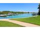 Calm waterfront with multiple boats and lush greenery at 100 Sands Point Rd # 305, Longboat Key, FL 34228