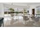 Open and airy community room with sliding glass doors at 100 Sands Point Rd # 305, Longboat Key, FL 34228