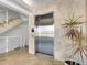 Modern elevator in building with tile floors and stairs at 100 Sands Point Rd # 305, Longboat Key, FL 34228