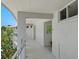 Clean condo hallway with light walls and modern decor at 100 Sands Point Rd # 305, Longboat Key, FL 34228