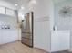 Modern kitchen with stainless steel refrigerator at 100 Sands Point Rd # 305, Longboat Key, FL 34228