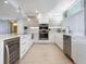 Modern kitchen with stainless steel appliances at 100 Sands Point Rd # 305, Longboat Key, FL 34228
