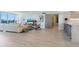 Spacious living room with water views and modern furniture at 100 Sands Point Rd # 305, Longboat Key, FL 34228