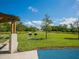 Park with grills, benches, and open green space at 100 Sands Point Rd # 305, Longboat Key, FL 34228