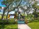 Wooden playground structure under shady oak trees at 100 Sands Point Rd # 305, Longboat Key, FL 34228