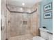 Large walk-in shower with tile surround at 100 Sands Point Rd # 305, Longboat Key, FL 34228