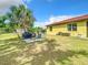 Backyard patio with grill and seating area, perfect for outdoor dining at 2930 Oceanside St, North Port, FL 34286