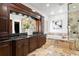Bathroom features a double vanity, soaking tub, and walk-in shower at 3544 San Remo Ter, Sarasota, FL 34239