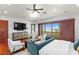 Main bedroom with water view, sitting area, and hardwood floors at 3544 San Remo Ter, Sarasota, FL 34239