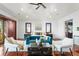 Main bedroom with sitting area and hardwood floors at 3544 San Remo Ter, Sarasota, FL 34239
