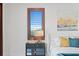 Bedroom features a nightstand and a window with plantation shutters at 3544 San Remo Ter, Sarasota, FL 34239