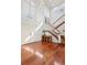 Grand entryway with hardwood floors and curved staircase at 3544 San Remo Ter, Sarasota, FL 34239