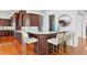 Gourmet kitchen featuring dark wood cabinetry and breakfast bar at 3544 San Remo Ter, Sarasota, FL 34239
