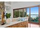 Living room with water views and hardwood floors at 3544 San Remo Ter, Sarasota, FL 34239