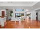 Two-story living room with hardwood floors and fireplace at 3544 San Remo Ter, Sarasota, FL 34239
