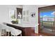 Modern wet bar with water views and custom cabinetry at 3544 San Remo Ter, Sarasota, FL 34239
