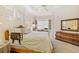 Comfortable main bedroom with a serene atmosphere, neutral color palette, and home office at 7249 Orchid Island Pl, Bradenton, FL 34202