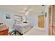 Light and airy bedroom with a ceiling fan and ocean-themed decor at 1415 Piedmont Rd, Venice, FL 34293