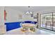 Charming dining area with white table and blue wainscoting at 1415 Piedmont Rd, Venice, FL 34293