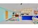 Open living room with a view of the kitchen and dining area at 1415 Piedmont Rd, Venice, FL 34293