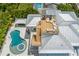 Elevated view of a home with a pool, spa, and rooftop deck with seating at 149 Mckinley Dr, Sarasota, FL 34236