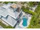 Elevated view of house, deck, and kidney-shaped pool and spa at 149 Mckinley Dr, Sarasota, FL 34236