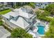 Aerial view of house with large deck and kidney shaped pool at 149 Mckinley Dr, Sarasota, FL 34236