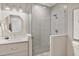 Elegant bathroom with a walk-in shower, gray tile, and a modern vanity at 149 Mckinley Dr, Sarasota, FL 34236